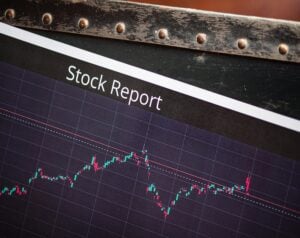Stock Report heading above a fluctuating stock price chart with green and red indicators on a dark grid background.