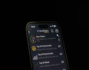 Smartphone screen showing the StockRadars app in dark mode with a list of radar items such as Basic Radars and Top 24 MostActiveVal.
