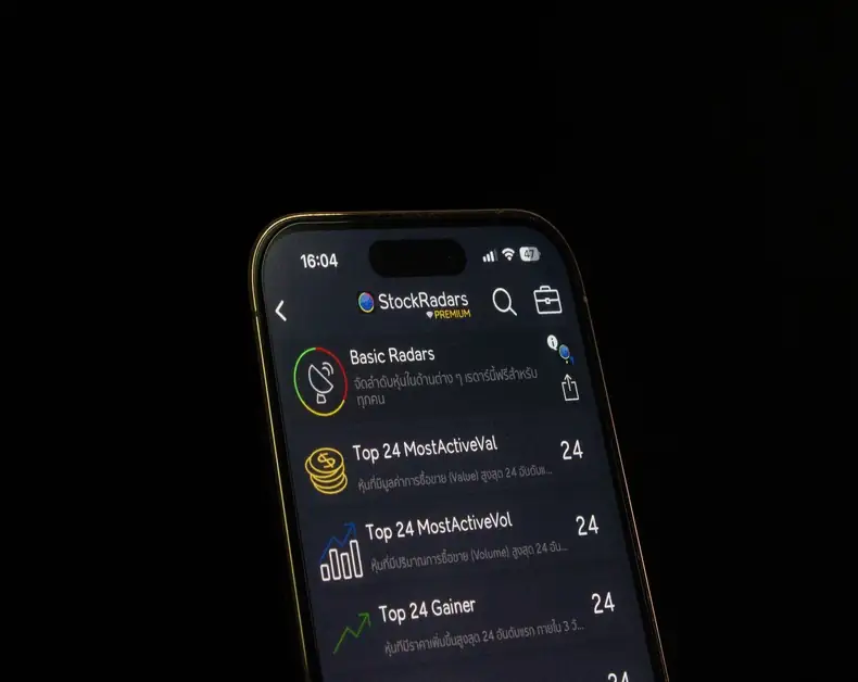 Smartphone screen showing the StockRadars app in dark mode with a list of radar items such as Basic Radars and Top 24 MostActiveVal.